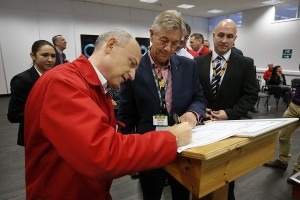 Pirelli UK’s industrial director Luca Negri signs the charter, watched by Kenny Barron, head of life-long learning for Unite.