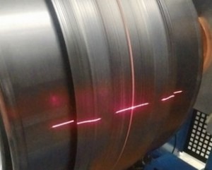  Examation production system uses lasers to help place components precisely