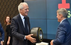  Pirelli CEO Tronchetti presents Romanian PM Dacian Ciolos with an F1wind-tunnel test tire at the event