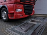  A truck prepares to drive over a fully-automated tire inspection system made by Ventech Systems