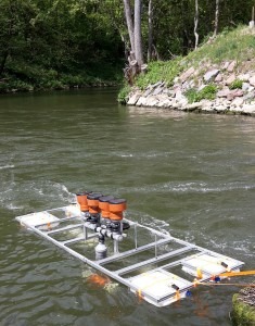  Field testing of DEGREEN generators in a small river – the silicone membranes are mechanically excited by negative pressure within the perfused Venturi tubes under the float. © Photo Fraunhofer ISC