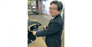  Naoki Miyazaki displays a cockpit module for a self-driving vehicle with an interface that monitors the driver's condition.