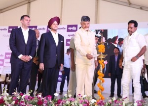  Andhra Pradesh chief minister lighting the lamp during the foundation stone laying ceremony of Apollo Tyres' facility in AP