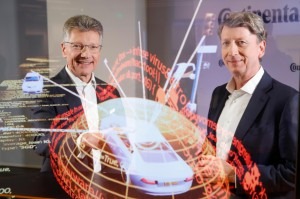  Continental CEO Elmar Degenhart and CFO Wolfgang Schäfer show the digital protection shield of a car.