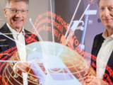  Continental CEO Elmar Degenhart (L) and CFO Wolfgang Schäfer show the digital protection shield of a car in March 2018