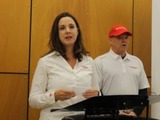Cara Adams, chief engineer for Bridgestone Americas Motorsports, and Al Unser Jr. announce plans to build a race tire facility in Akron
