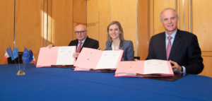  Faurecia CEO Patrick Koller (L), Agnès Pannier-Runacher, French economy and finance minister (C) and Michelin general manager Florent Menegaux singing the MoU.
