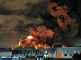UK police arrest two in connection with tire fire