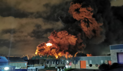 UK police arrest two in connection with tire fire